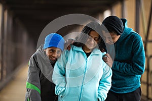 Hispanic Mother Walks With Sons On A Bridge