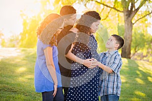 Hispanic Pregnant Family Portrait Outdoors