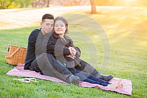 Hispanic Pregnant Young Couple Picnic Portrait Outdoors