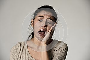 Hispanic sad woman serious and concerned crying desperate overacting on feeling depressed