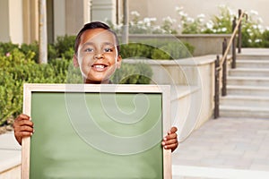 Hispanic School Boy Holds Blank Chalk Board on School Campus