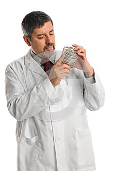 Hispanic Scientist Holding bacteria in Petri Dish