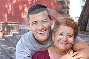 Hispanic senior woman with her son