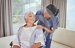 A hispanic senior woman in a wheelchair and her female nurse in the old age home. Mixed race young nurse and her patient