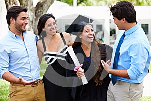 Hispanic Student And Family Celebrating Graduation