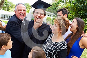 Hispanic Student And Family Celebrating Graduation