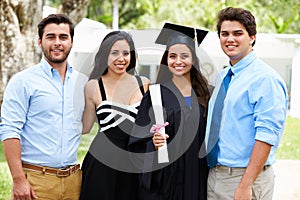 Hispanic Student And Family Celebrating Graduation