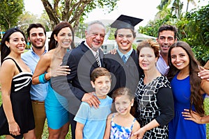 Hispanic Student And Family Celebrating Graduation