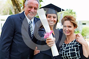 Hispanic Student And Parents Celebrate Graduation