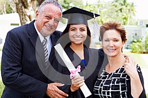 Hispanic Student And Parents Celebrate Graduation