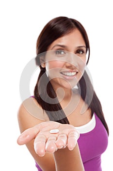 Hispanic teen girl with medicine pill