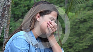 Hispanic Teen Girl Tearful With Emotional Pain