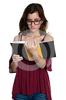 Hispanic teenage girl with glasses reading a book - On a white background