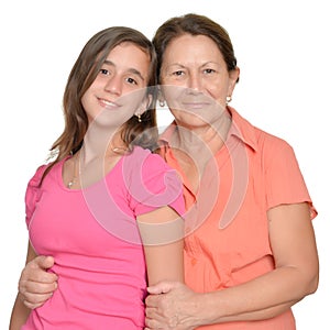 Hispanic teenage girl and her grandmother isolated on white