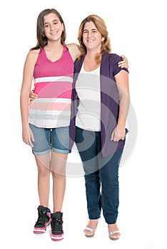 Hispanic teenage girl hugging her mother isolated on white