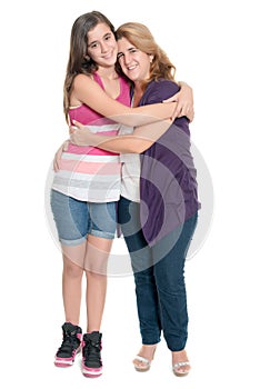 Hispanic teenage girl hugging her mother isolated on white