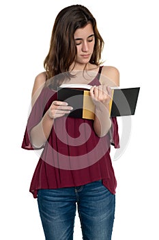 Hispanic teenage girl reading a book - Isolated on white