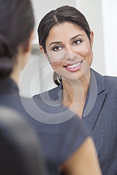 Hispanic Woman or Businesswoman in Office Meeting