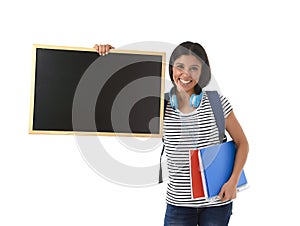 Hispanic woman or female student holding blank blackboard with copy space for adding message