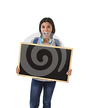 Hispanic woman or female student holding blank blackboard with copy space for adding message