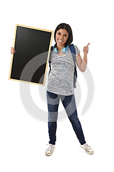 Hispanic woman or female student holding blank blackboard with copy space for adding message