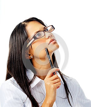 Hispanic woman with glasses thinking with pen