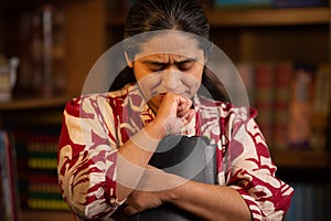 Hispanic Woman Holding Bible and Praying