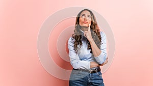 Hispanic woman looking around with thoughtful expression