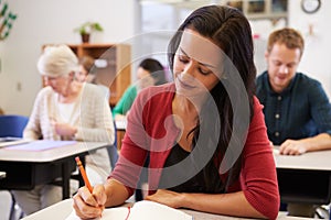 Hispanic woman studying at an adult education class