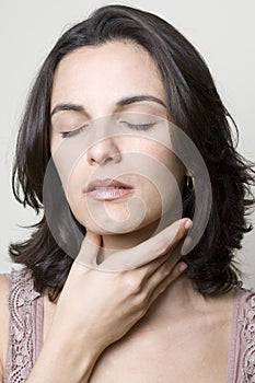 Hispanic woman with throat pain