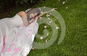 Hispanic woman in white gown