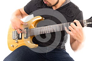 Hispanic young man playing electric guitar