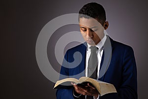 Hispanic Young Teenager Boy Searching the Scriptures, The Word of God, The Bible