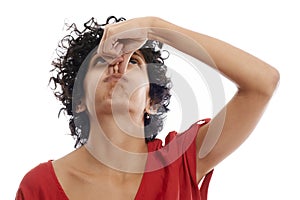 Hispanic young woman holding breath