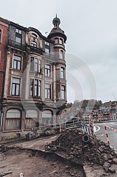 Historic Architecture in Dinant: Rainy Day Charm with Open Road