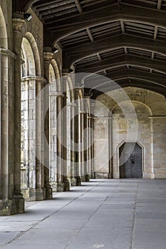 Historic archway with stone columns and wooden ceilling