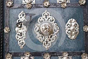 A historic an artificial detail of a gate with door handle