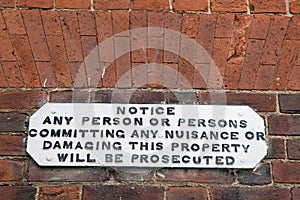 Historic black and white lettered warning sign photo
