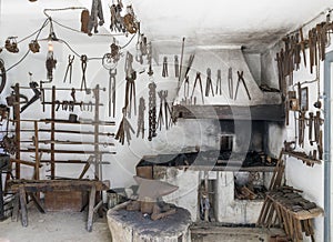 Historic blacksmith workshop with old tools and forge