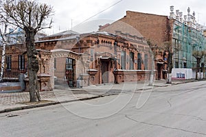 Historic brick building of the city hospital of the Society of Doctors 1888 against the background of the renovated House of