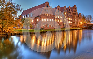 Historic brick buildings on Trave River.