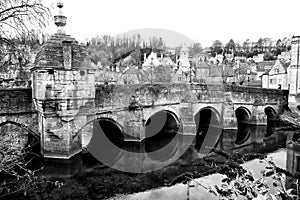 Historic bridge in monochrome spanning river in Bradford on Avon
