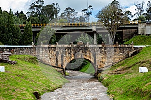 Historic Bridge over the Teatinos River in Colombia located next to the Boyaca Bridge photo