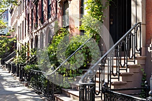 Historic brownstone buildings on a sunny summer day in the Gramercy Park neighborhood of New York City