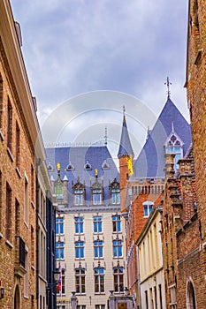 Historic Bruges city buildings on cloudy summer day Belgium