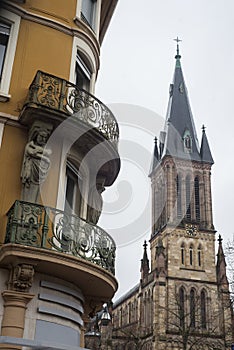 historic building with balcony on st Etienne church on background in Mulhouse - France