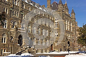 Historic building on Georgetown University campus in winter.