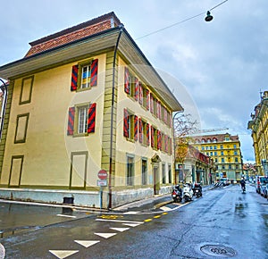 Historic building on Nageligasse street is a fine example of the traditional Bernese architecture with scenic window shutters,