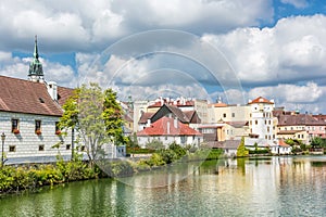 Historic buildings with reflections in water reservoir, Jindrichuv Hradec