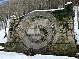 Historic Camprodon fountain in its urban center in winter